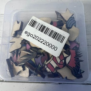 Container with decorative items and a barcode label on a white background