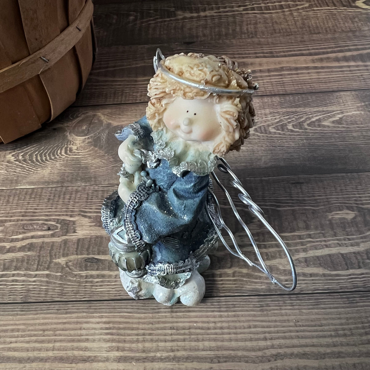 Decorative angel figurine on a wooden surface