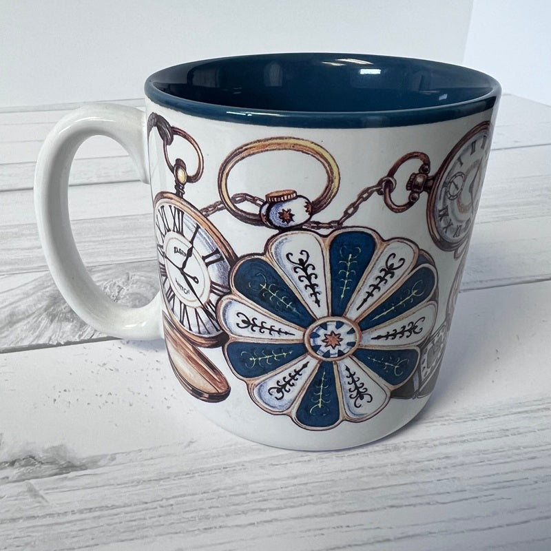 Mug with decorative design on a white wooden surface