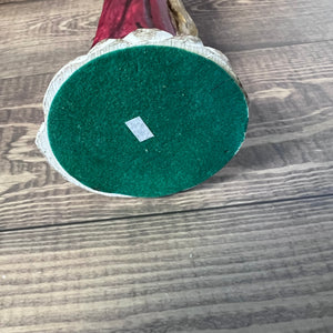 Green felt circle on a wooden surface