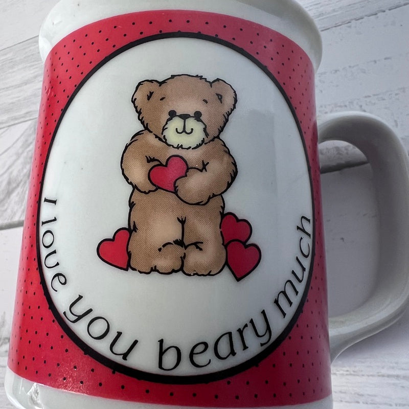 Mug with teddy bear and heart design, text 'I love you beary much', on a white background