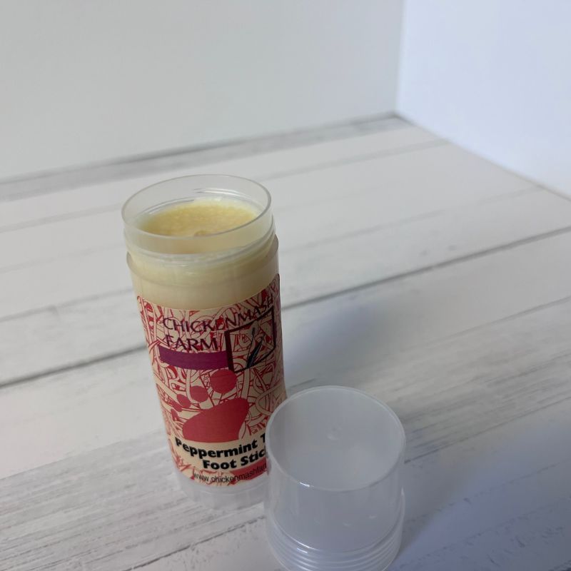 Foot stick with red label on a white wooden surface