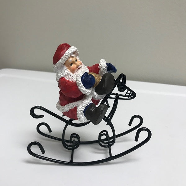 Christmas Santa Claus Riding On Rocking Horse Decoration