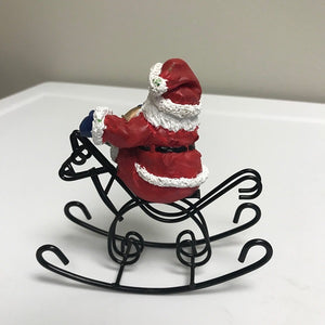 Christmas Santa Claus Riding On Rocking Horse Decoration