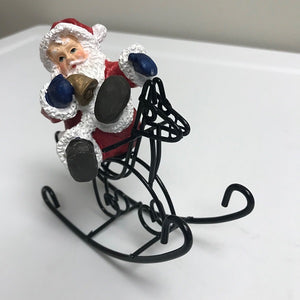 Christmas Santa Claus Riding On Rocking Horse Decoration