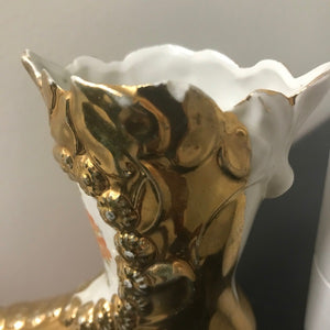 gold porcelain boot chipped