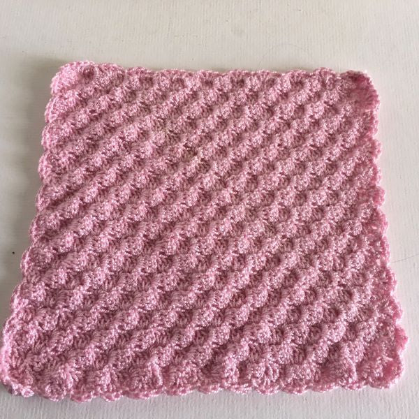 pink crocheted washcloth