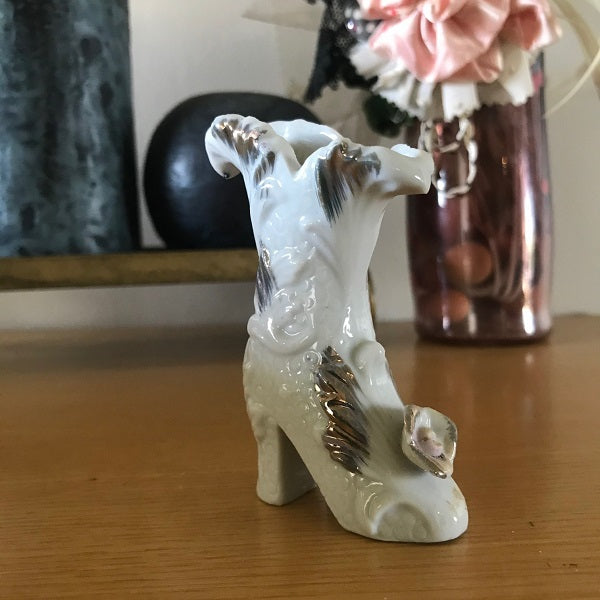 white and gold boot bud vase