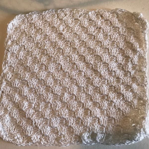 white crocheted washcloth